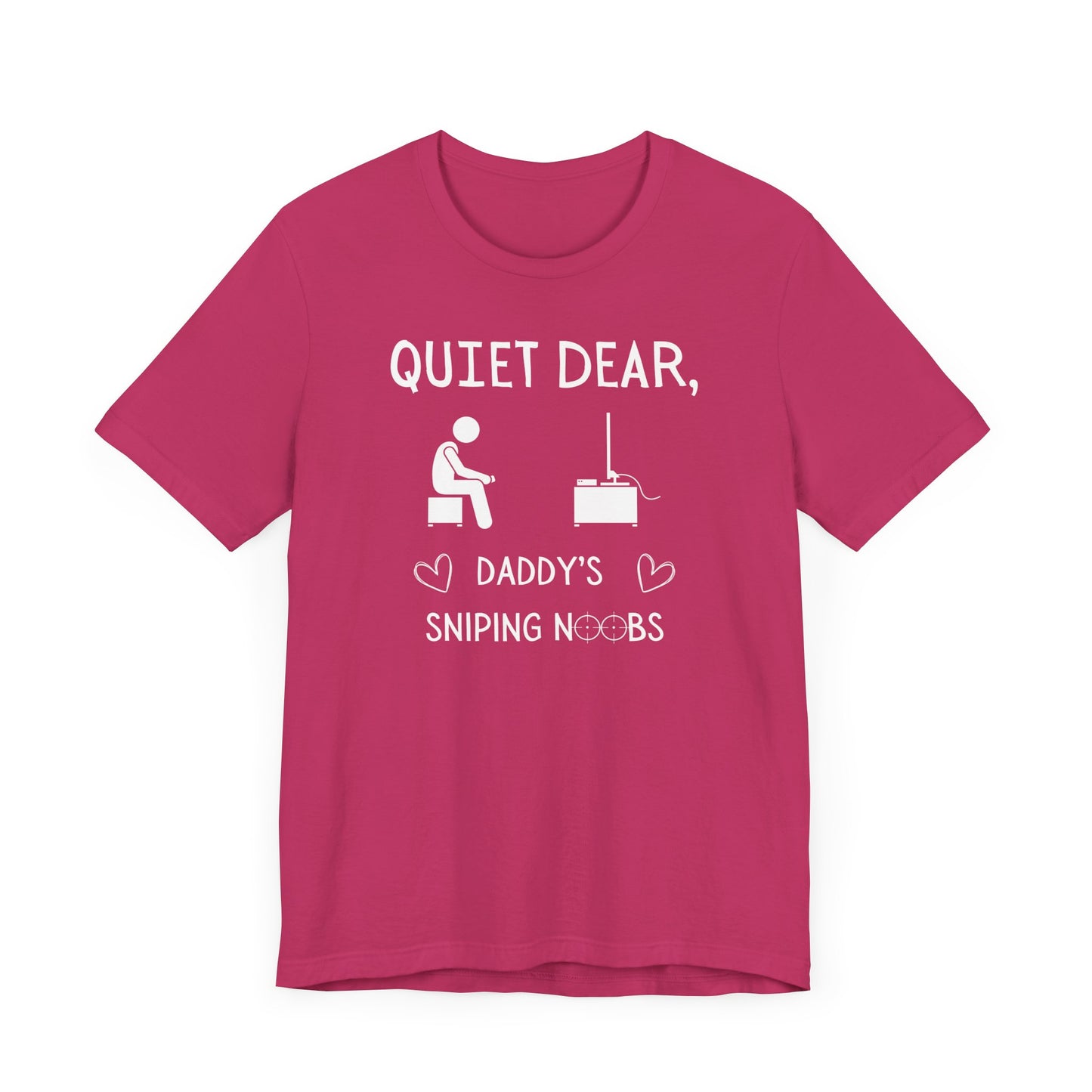 A flat image of a berry pink t-shirt that reads Quiet Dear, Daddy's Sniping Noobs in white text. The lower text is framed by two hearts, and the O's are in the shape of sniper scopes. In the center of the shirt is an image of a person holding a controller sitting across from a TV.