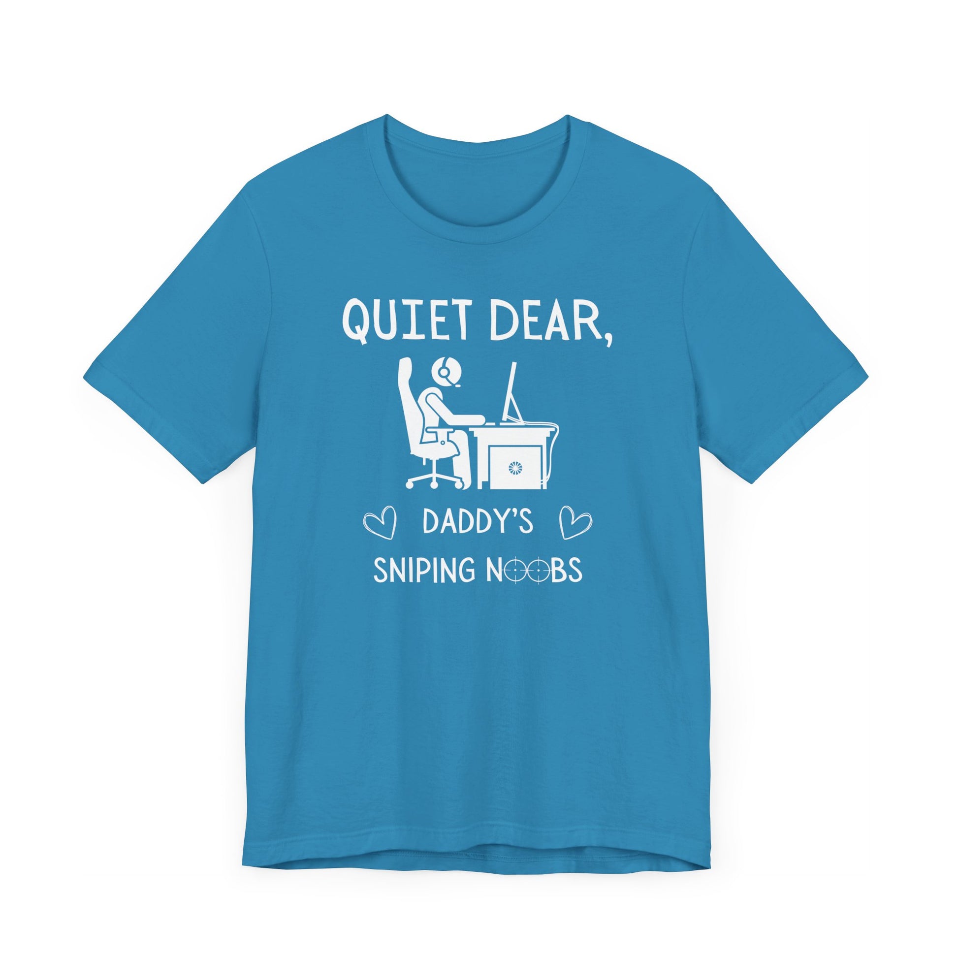 A flat image of an aqua t-shirt that reads Quiet Dear, Daddy's Sniping Noobs in white text. The lower text is framed by two hearts, and the O's are in the shape of sniper scopes. In the center of the shirt is an image of a person at a desk with a gaming PC.