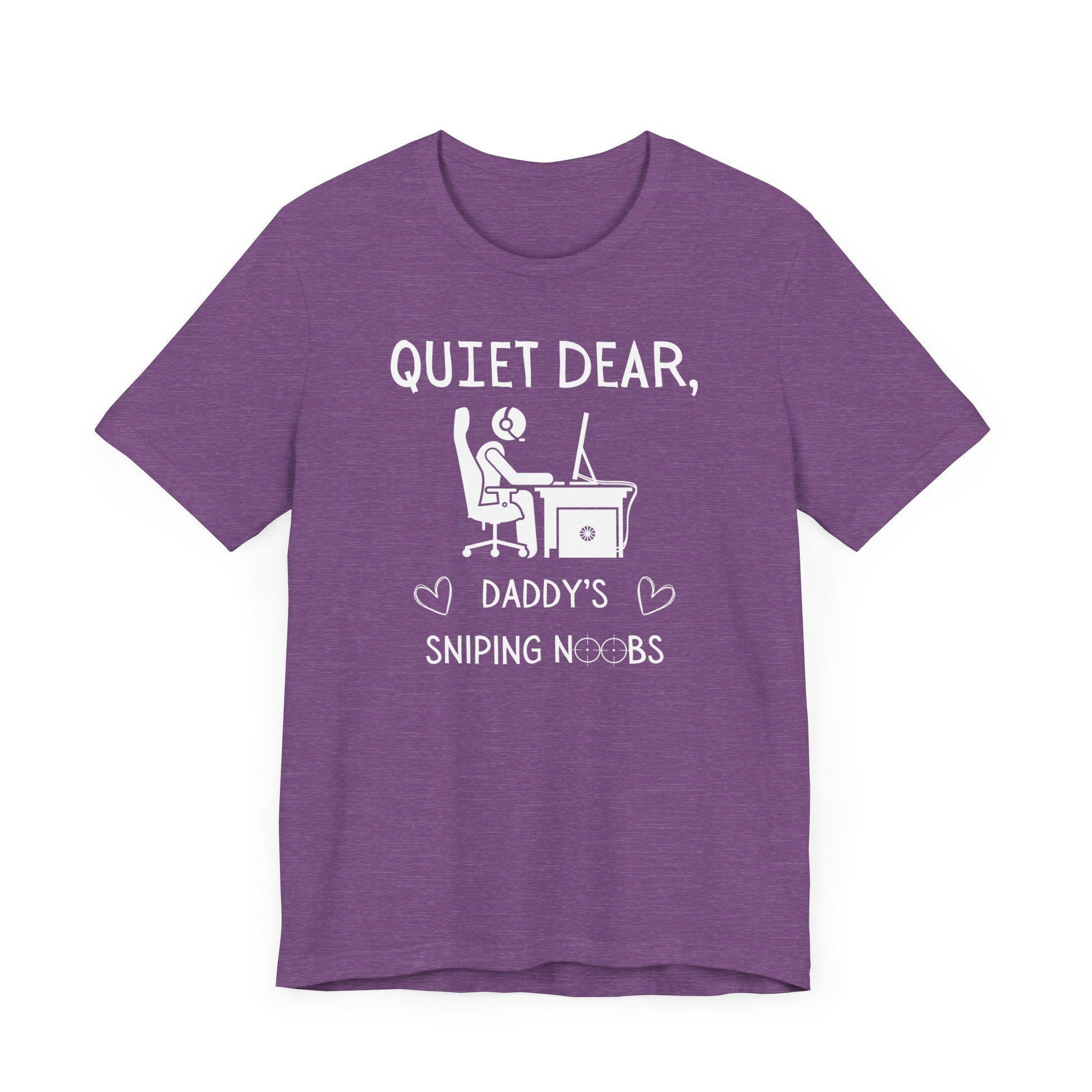 A flat image of a purple heather t-shirt that reads Quiet Dear, Daddy's Sniping Noobs in white text. The lower text is framed by two hearts, and the O's are in the shape of sniper scopes. In the center of the shirt is an image of a person at a desk with a gaming PC.